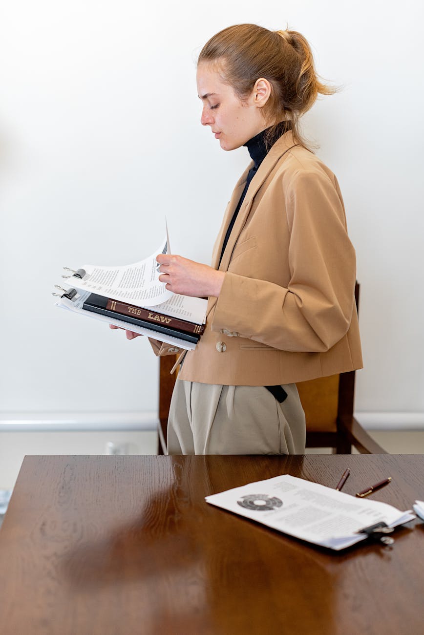 Legal assistant filing documents in organized law firm file room